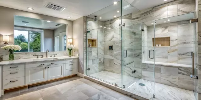 sleek modern bathroom features a spacious walk in shower with a frameless glass door, stainless steel handle, and walls clad in gleaming white marble tiles.